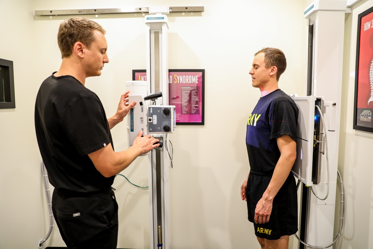 Dr. Emmerich positioning a patient at the X-ray unit